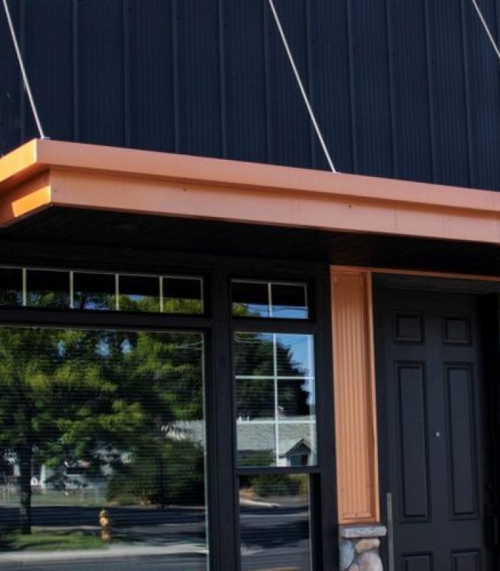 Storefront with Black and copper penny steel Siding, APEX PANEL